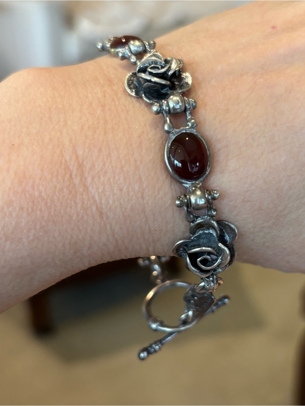 Sterling Silver Rose Link Bracelet with cabochon amber Stones.